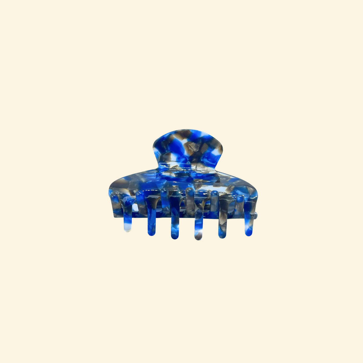 Presilha de acetato mosaico azul vista de lado, com garras curvadas