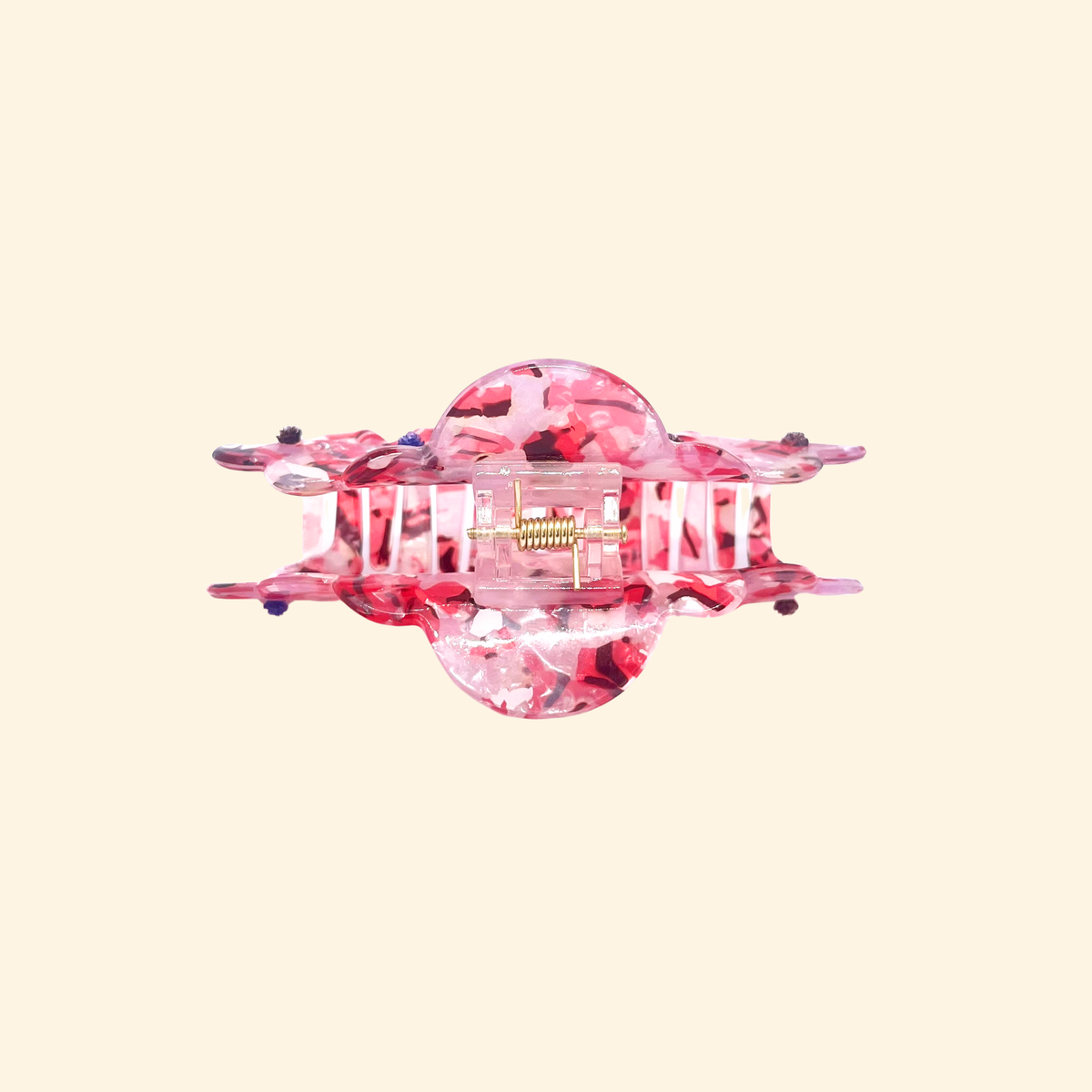Presilha de acetato rosa estampado, vista de lado