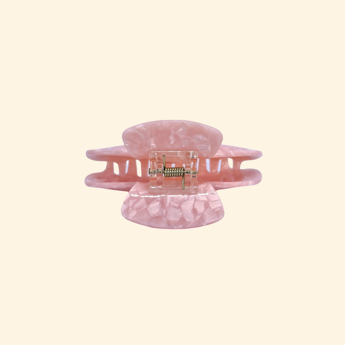 Presilha lisa de acetato rosa marmorizado vista de lado, com garras curvadas